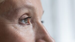 Close up of older woman's eye in profile