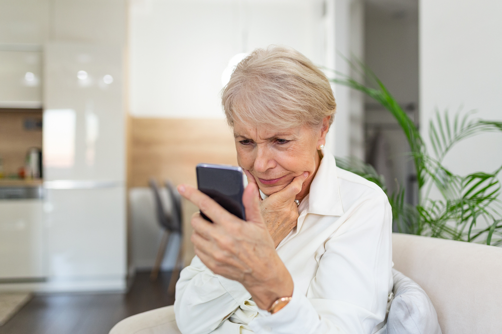 Senior woman looking at smart phone